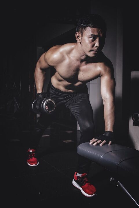 Man doing dumbbell bent over rows