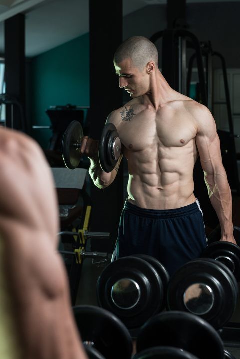 man doing dumbbell curls