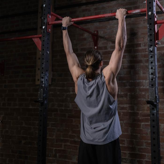 Muscular man doing pull ups