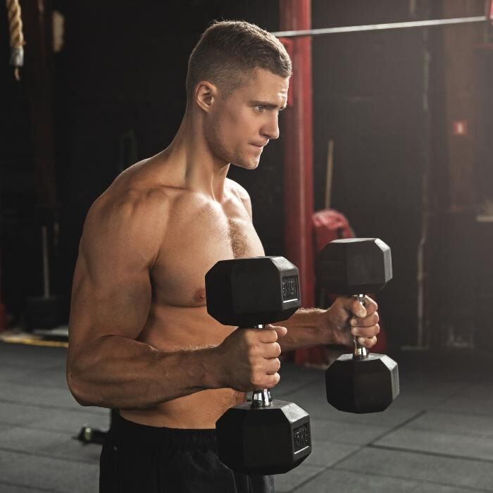 man doing hammer curls to build thicker wrists