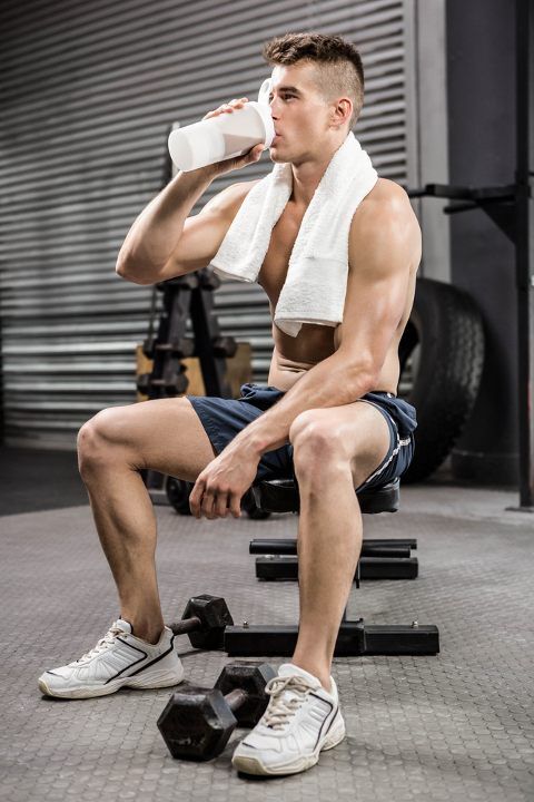 Man drinking pre-workout before training