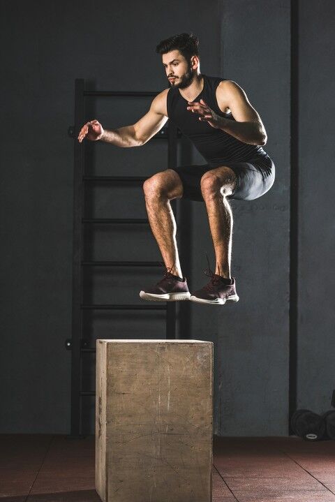 Man performing the box jump exercise